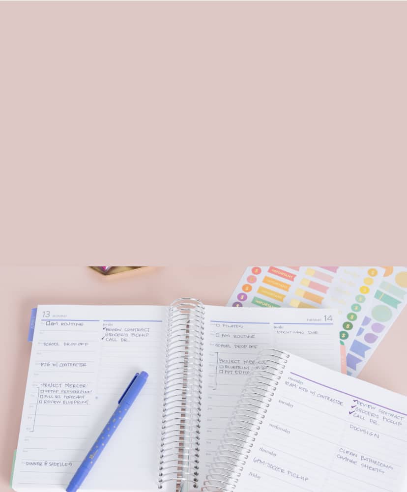 two open A5 planners showing hourly layout with writing inside. Accessories nearby.