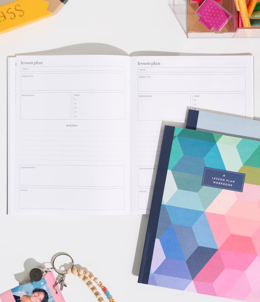 Softbound teacher lesson planners featuring new designs. Close up view of softbound planners featuring reflective and shiny paper edges. Woman holding a teacher lesson planner featuring hexagon design.