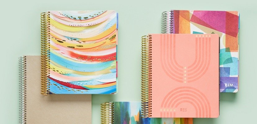 Overhead view of coiled vegan leather planners