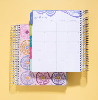 An open planner showing a monthly layout