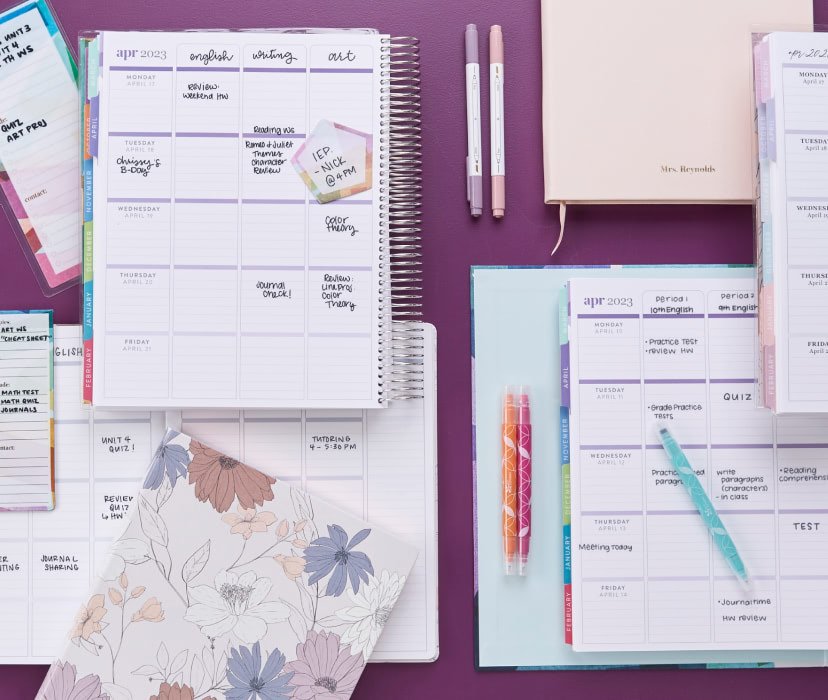 Overhead view of an assortment of Teacher Lesson Planners and accessories - Including a Binder, Softbound, Focused, and Coiled Planners.