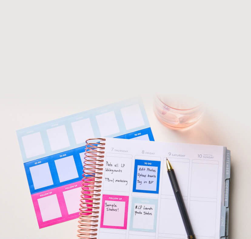Buy One, Get One 50% OFF Stickers. Image of Stickers in use on a planner sitting on a desk. Click to shop now.