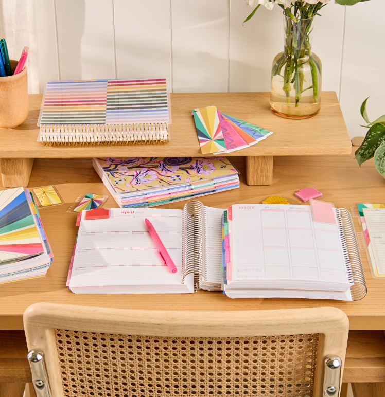 View of two coiled LifePlanners featuring 2025 Designs.