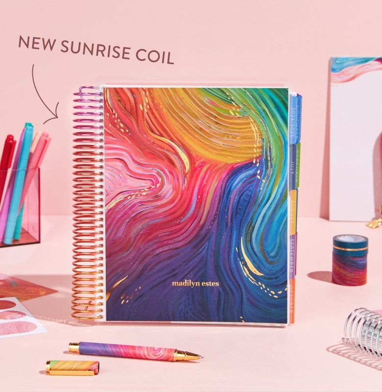 rainbow coiled lifeplanner featuring evolve cover and accessories.
