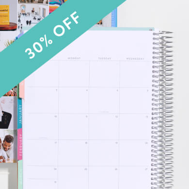 coiled monthly planner showing monthly layout. click to shop now.