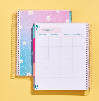 An open planner showing an undated monthly layout for families