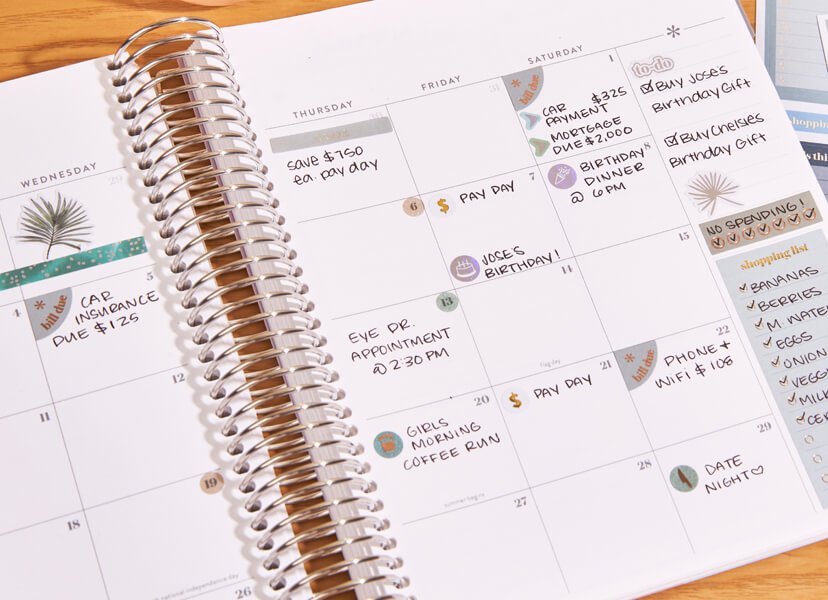 Overhead image of vertical layout LifePlanner featuring sticker accessories inside.