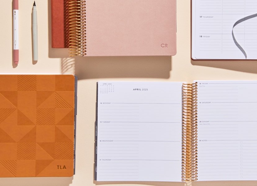assorted coiled focused planners and accessories.
