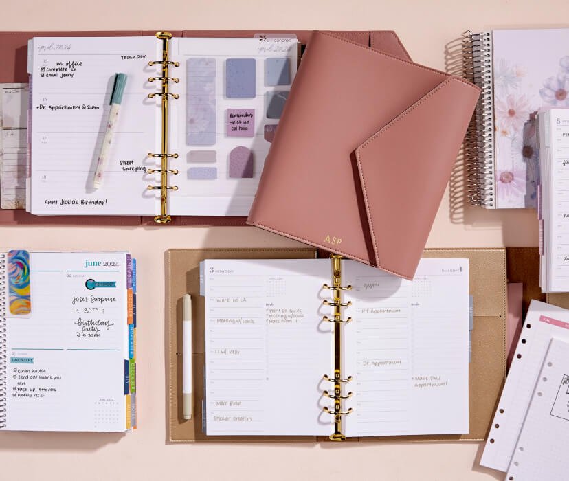 overhead view of a5 coiled planners, ring agendas, and accessories