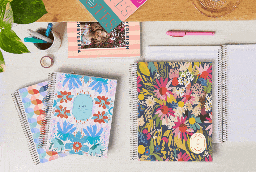 Grid image of NEW notebooks with NEW designs with NEW checklist layout on a desk with accessories. Click to shop notebooks.