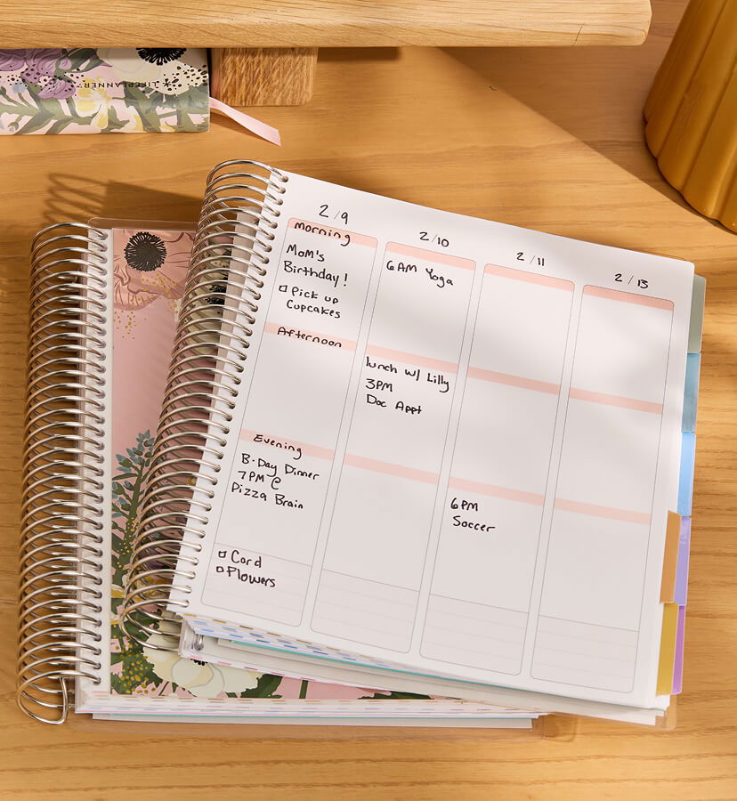 NEW Undated Planners with NEW designs on a desk with accessories. Click to shop.