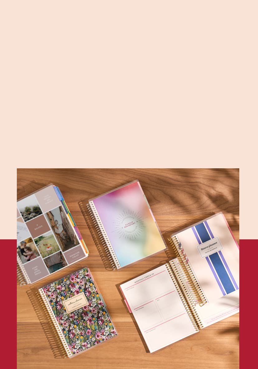 assortment of coiled planners including new vision board lifeplanner and guided planners