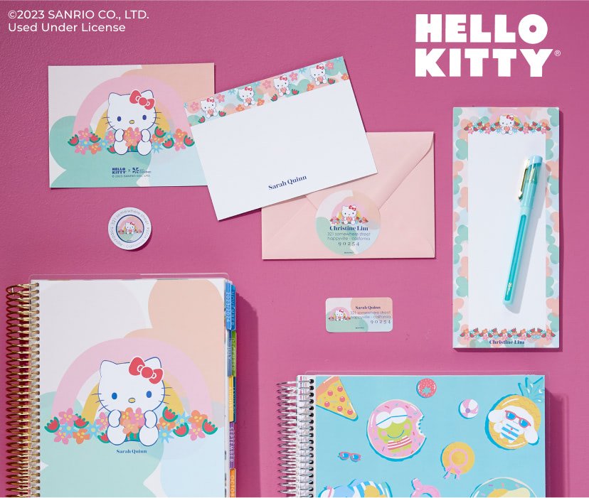 overhead view of coiled planners, notebooks, and accessories featuring Hello Kitty designs.