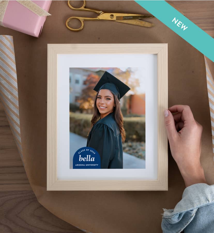 Light wood picture frame featuring a graduation photo of a woman in a cap and gown.