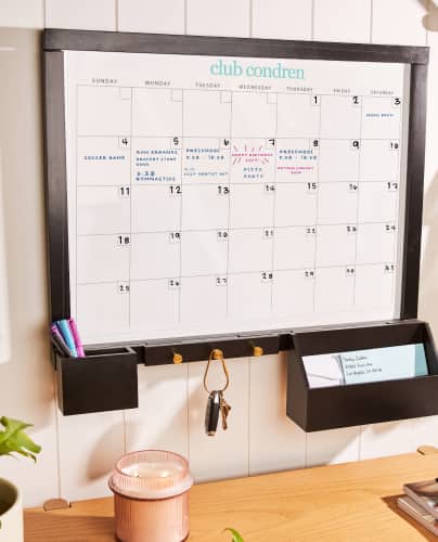 Wall Organization center featuring monthly layout mounted on a wall in a white room. Click to shop now.