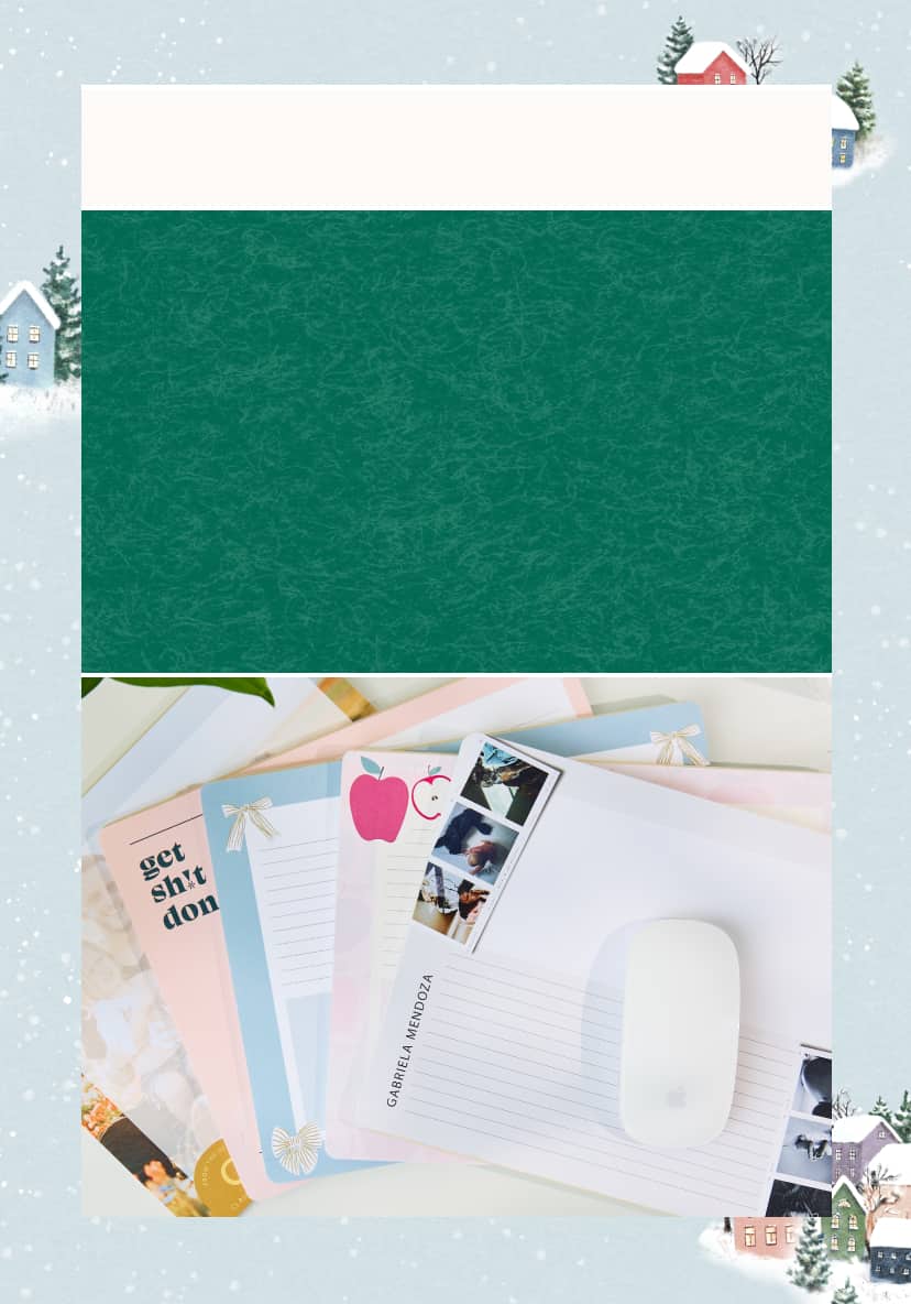 image of assorted mouse pads on a white desk on top of a blue snowy winter illustration featuring snowy houses and trees.