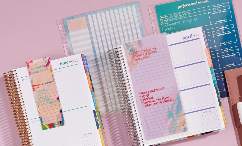 overhead view of assorted coiled planners featuring snap in and magnetic dashboards